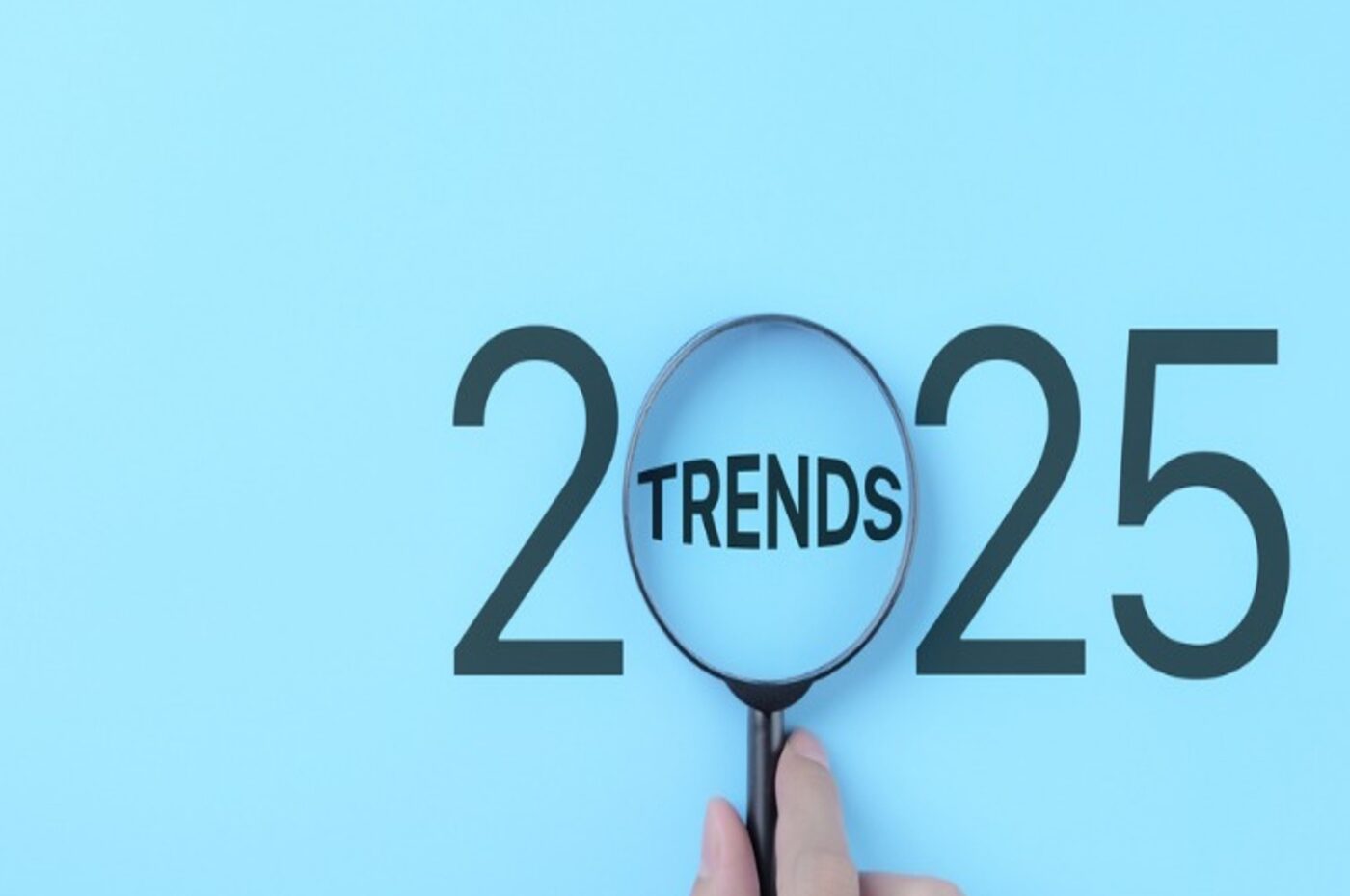 2025 with magnifying glass highlighting "Trends" in blue background