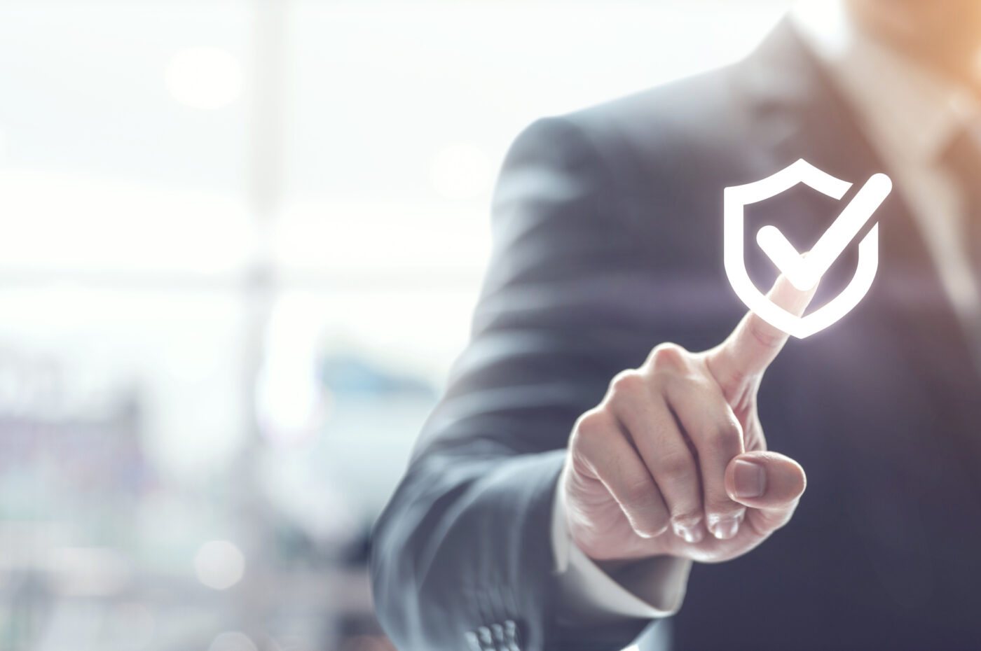 Businessperson assuring security with holographic checkmark badge