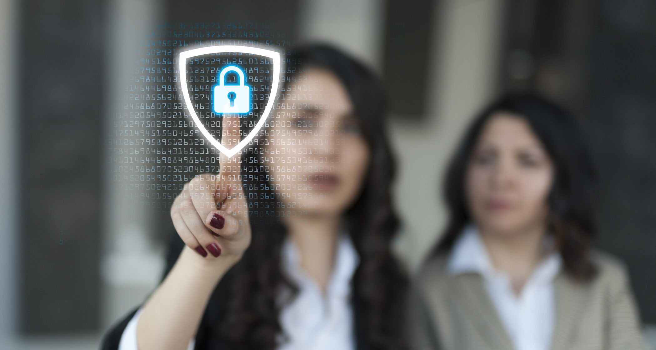 A woman in business attire interacts with a digital security interface displaying a lock symbol
